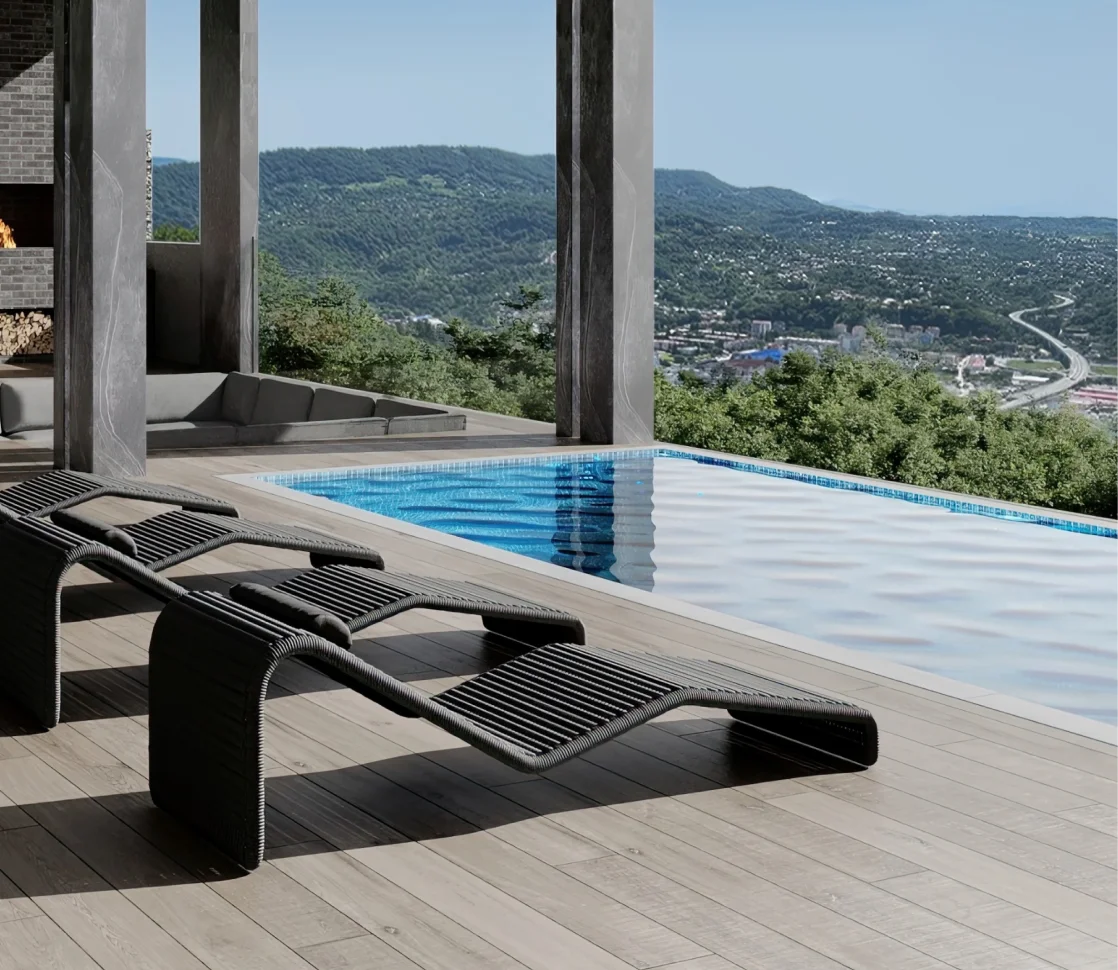 Lounge chairs on a Resysta composite deck overlooking the ocean