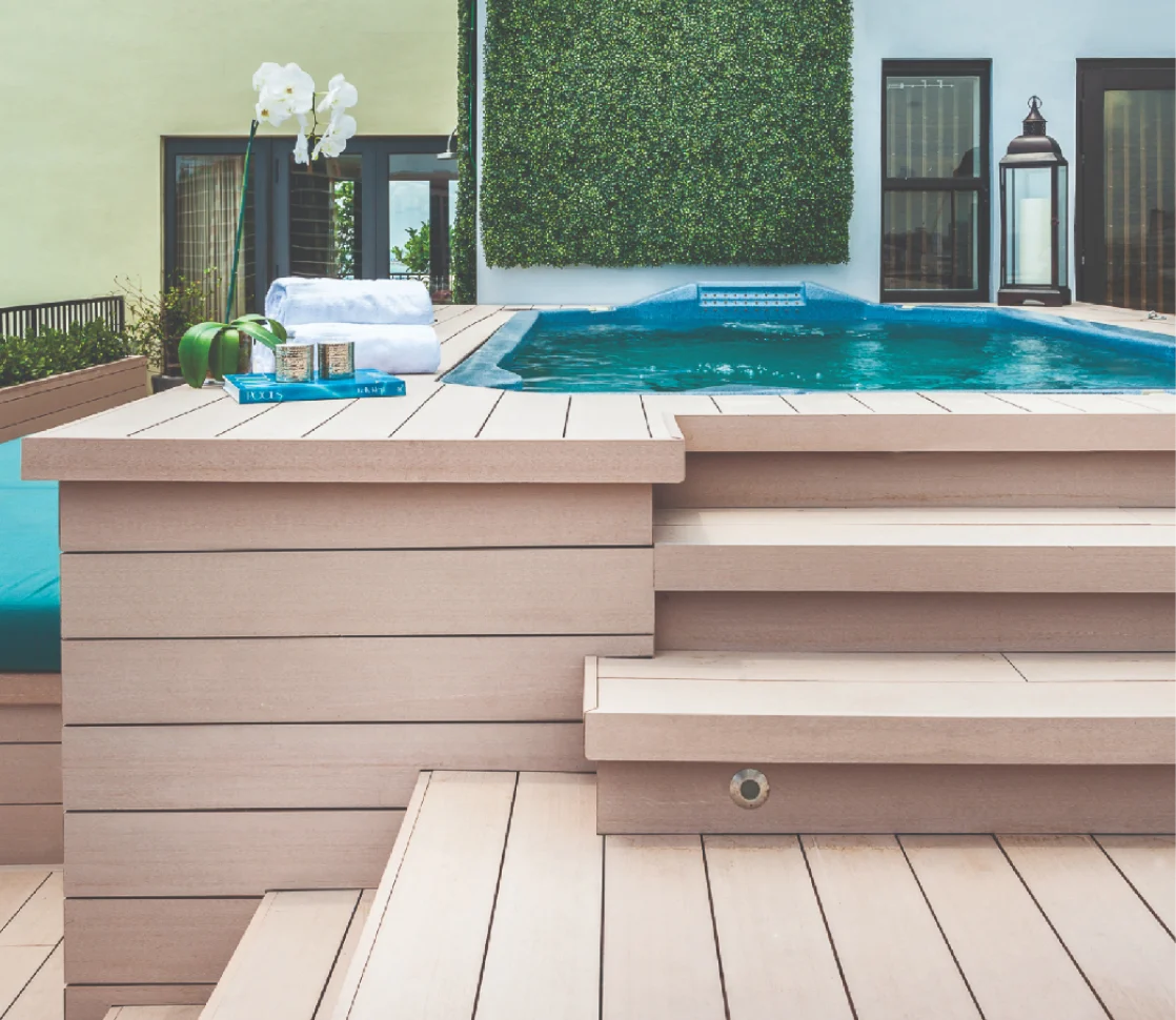 Hot tub surrounded by Resysta composite decking steps