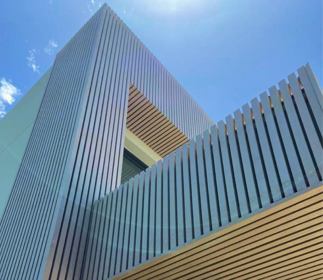 Modern commercial building exterior with Resysta vertical facade slats